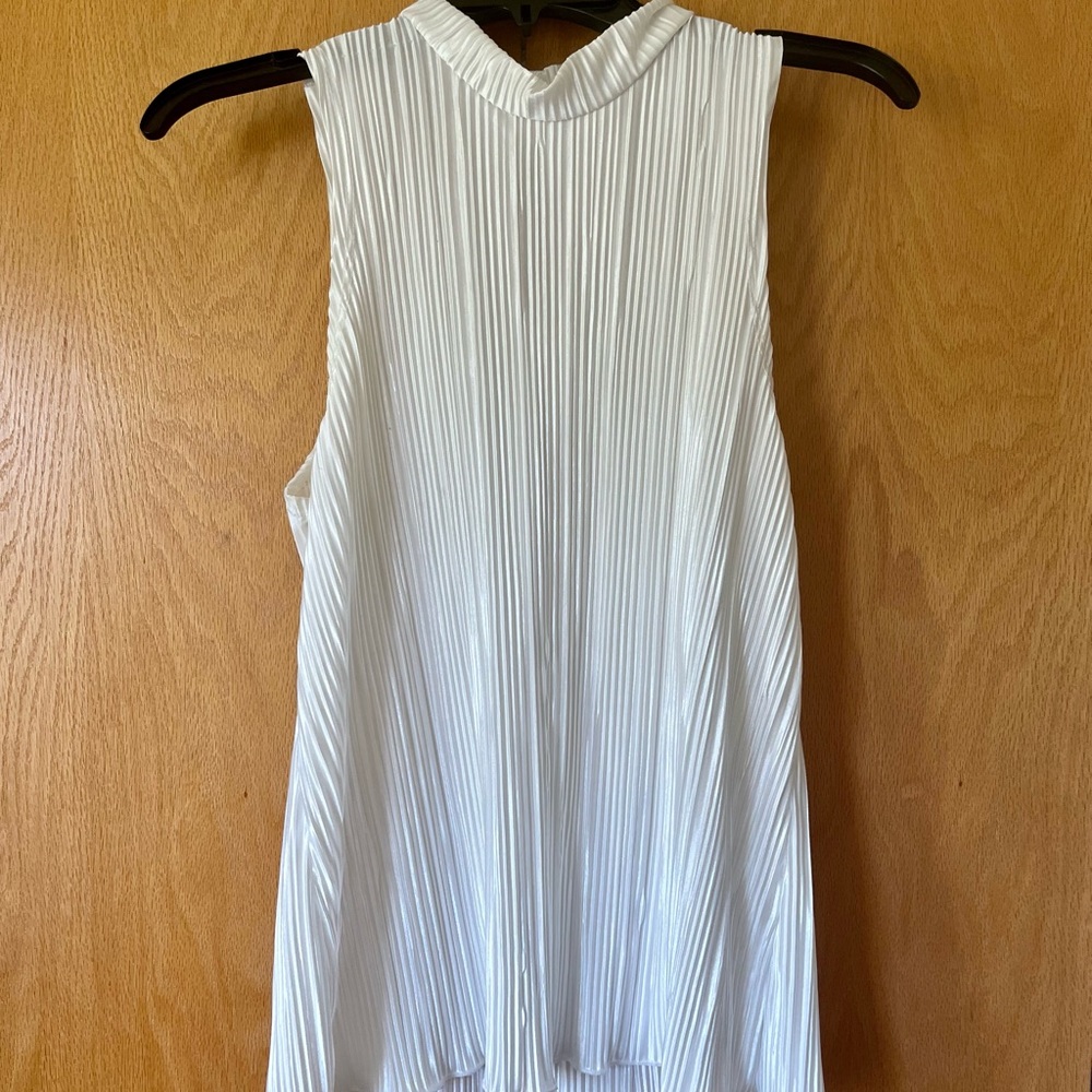 White sleeveless blouse